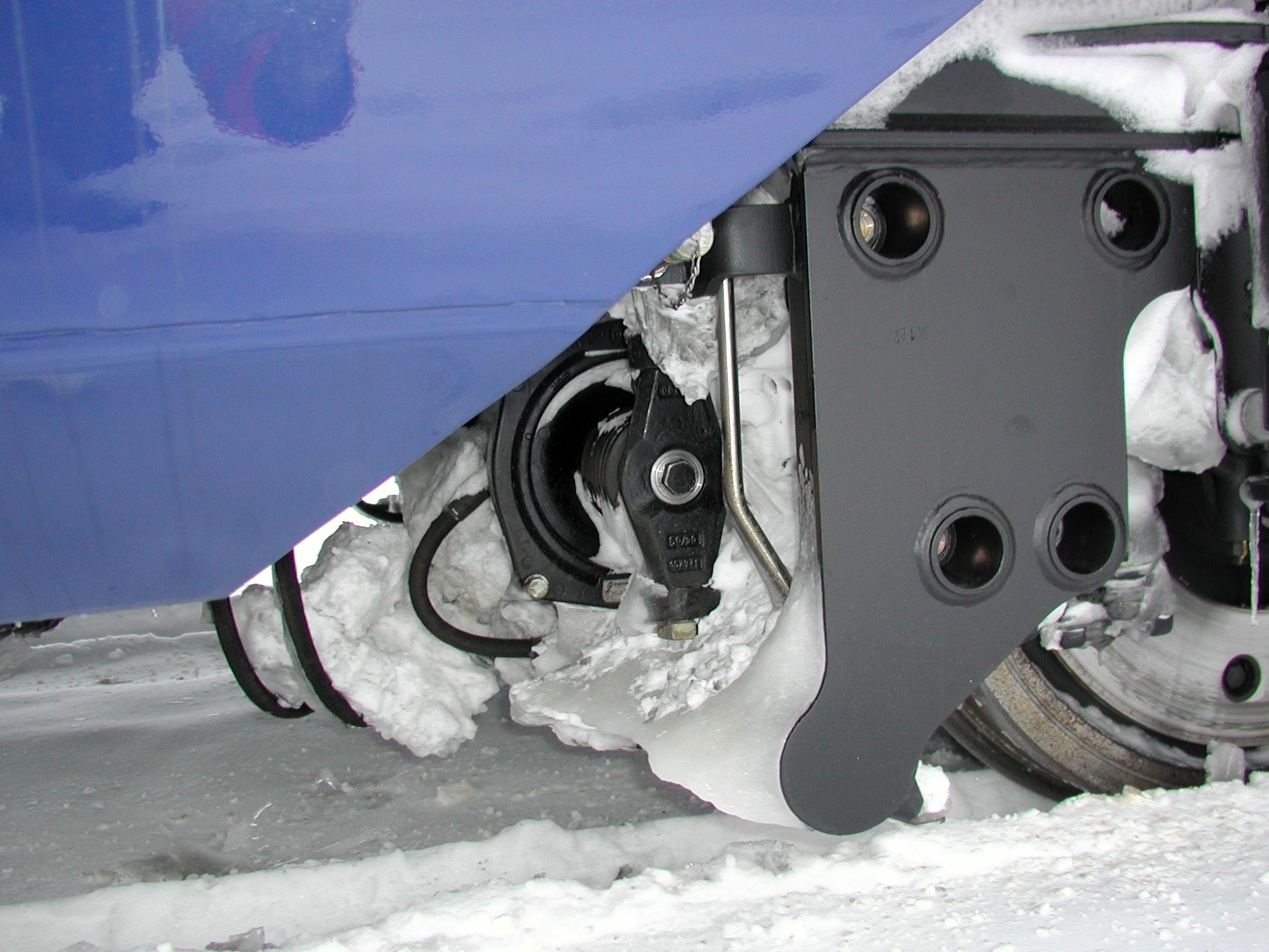  Snow and Ice covering the braking system of a passenger train